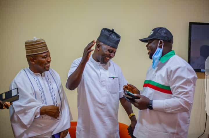 Hon. Ziphion Chrysanthus felicitates with Hon. Musa Agah and Ndah Peter Dasat